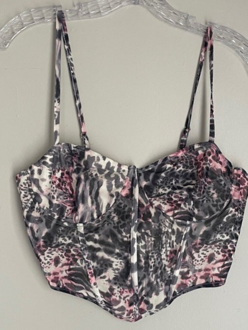 Fierce and flirty mesh bustier top in a pink + grey animal print.